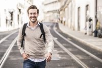 portrait-of-smiling-young-man-with-backpack-in-the-2022-12-16-22-25-17-utc.jpg